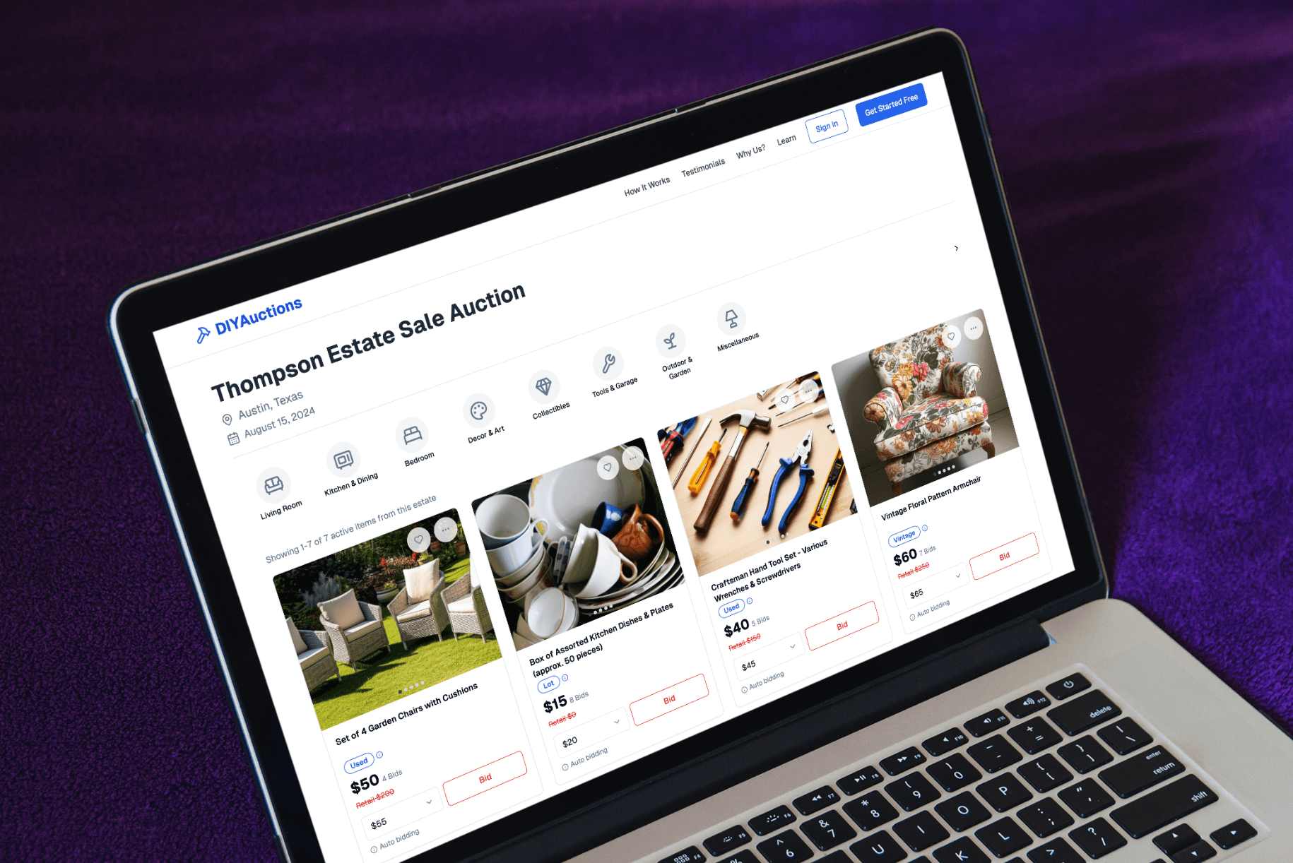 DIYAuctions platform displayed on a laptop at an angle, showing an active estate sale auction with various items.